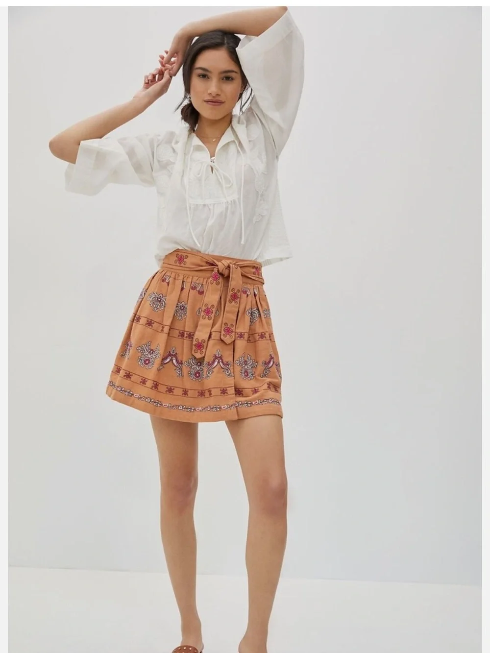 Anthropologie Meghan terracotta embroidered folkloric mini wrap skirt. Size 0